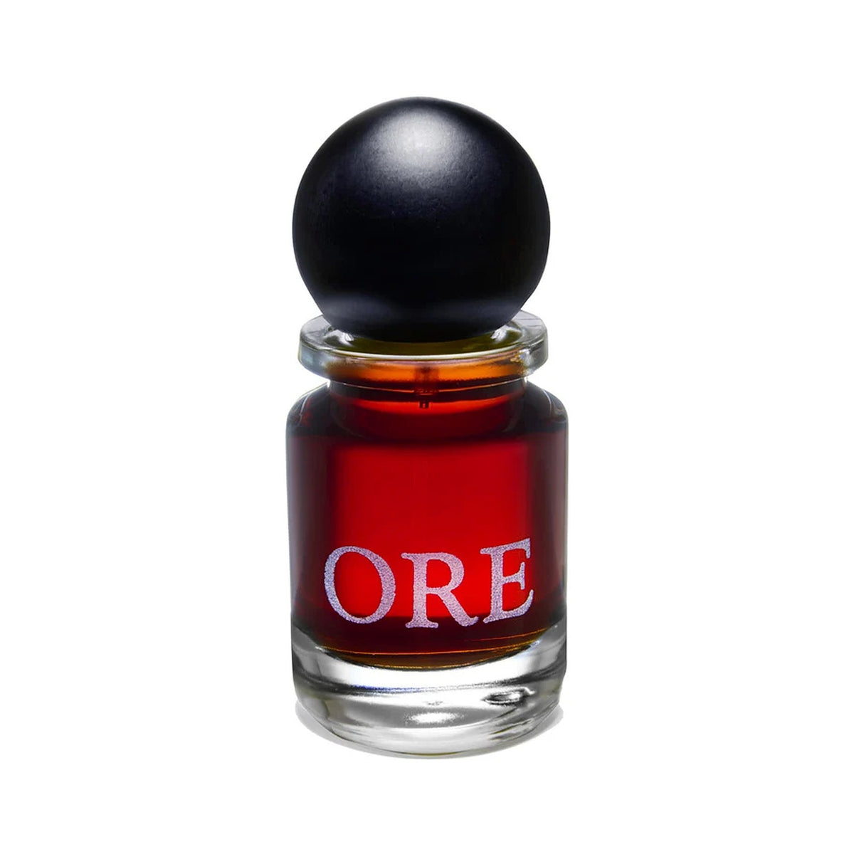 Ore by Slumberhouse, red extrait in a squat glass bottle under a black ball cap