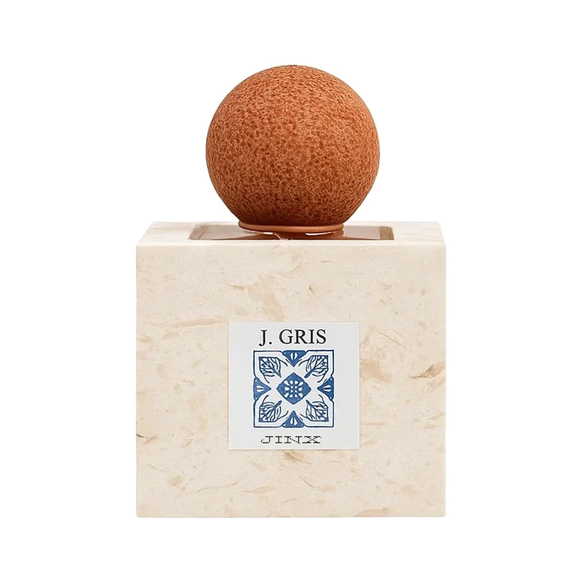 J-Gris by Jinx Smells, a cream stone cube bottle with a blue tile label reading J. GRIS and a round terracotta cap