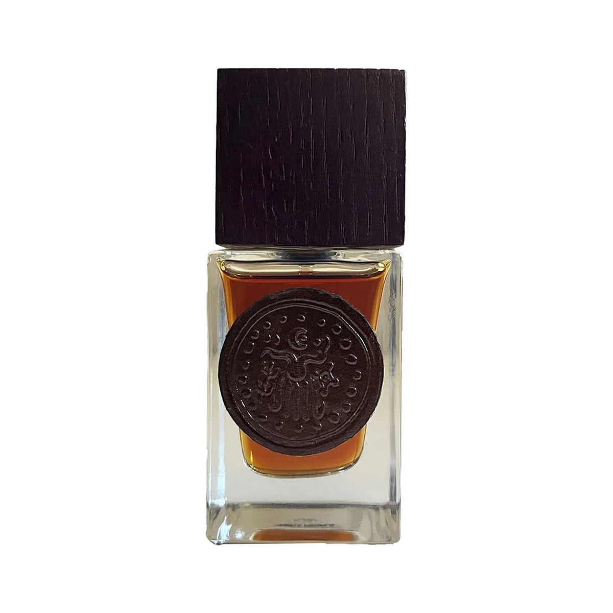 Kaavu by Chera People, a clear square flask of amber juice with a dark wooden cap and a round embossed medallion