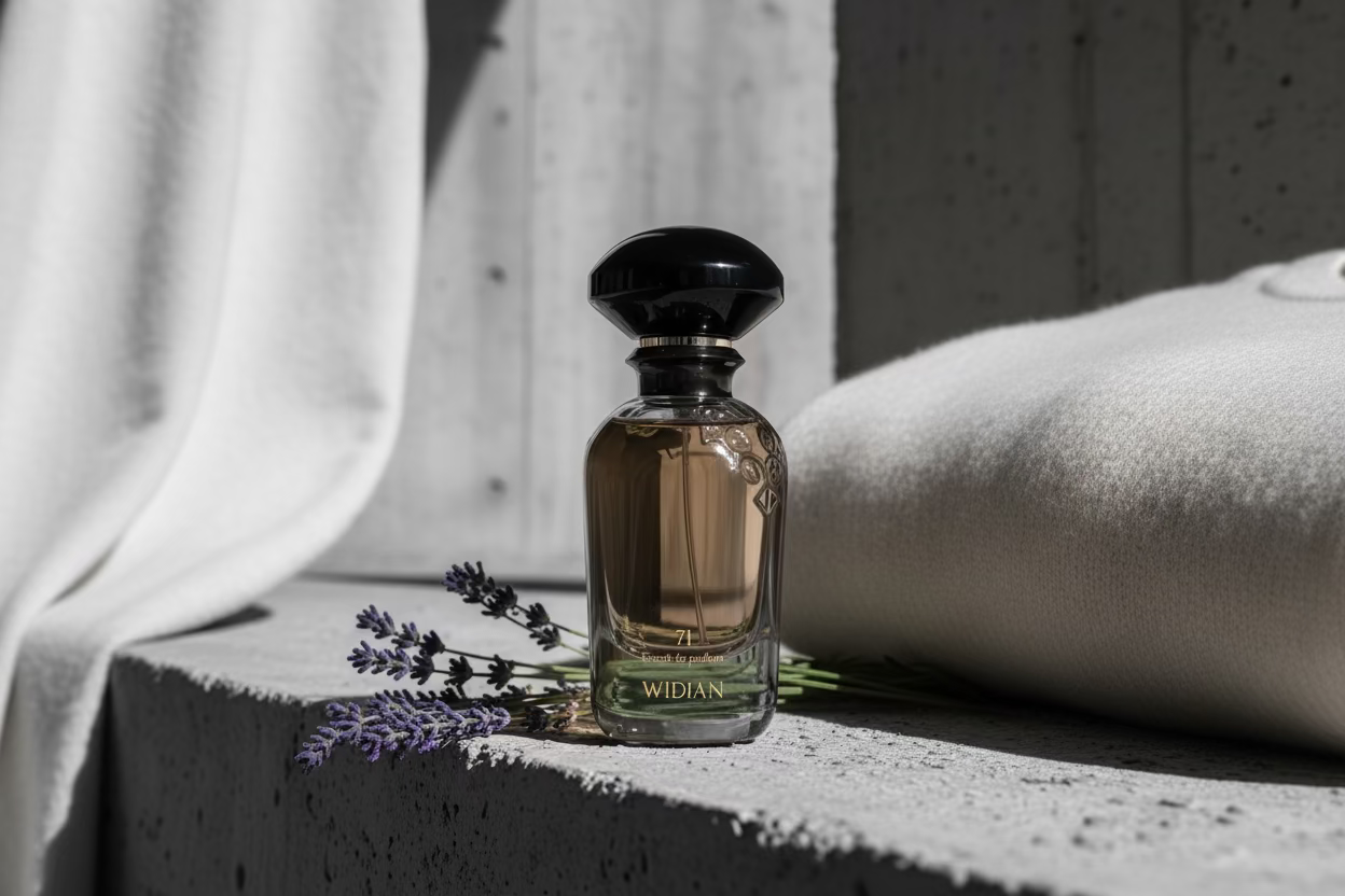 Perfume bottle with lavender on a stone surface