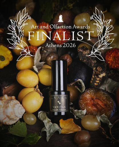 Vanitas by LVNEA in a still life of fruit and shells, with the Art and Olfaction Awards Finalist banner, Athens 2026